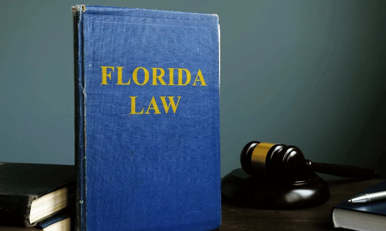 Florida law book and gavel representing disclosure requirements for fire damaged homes